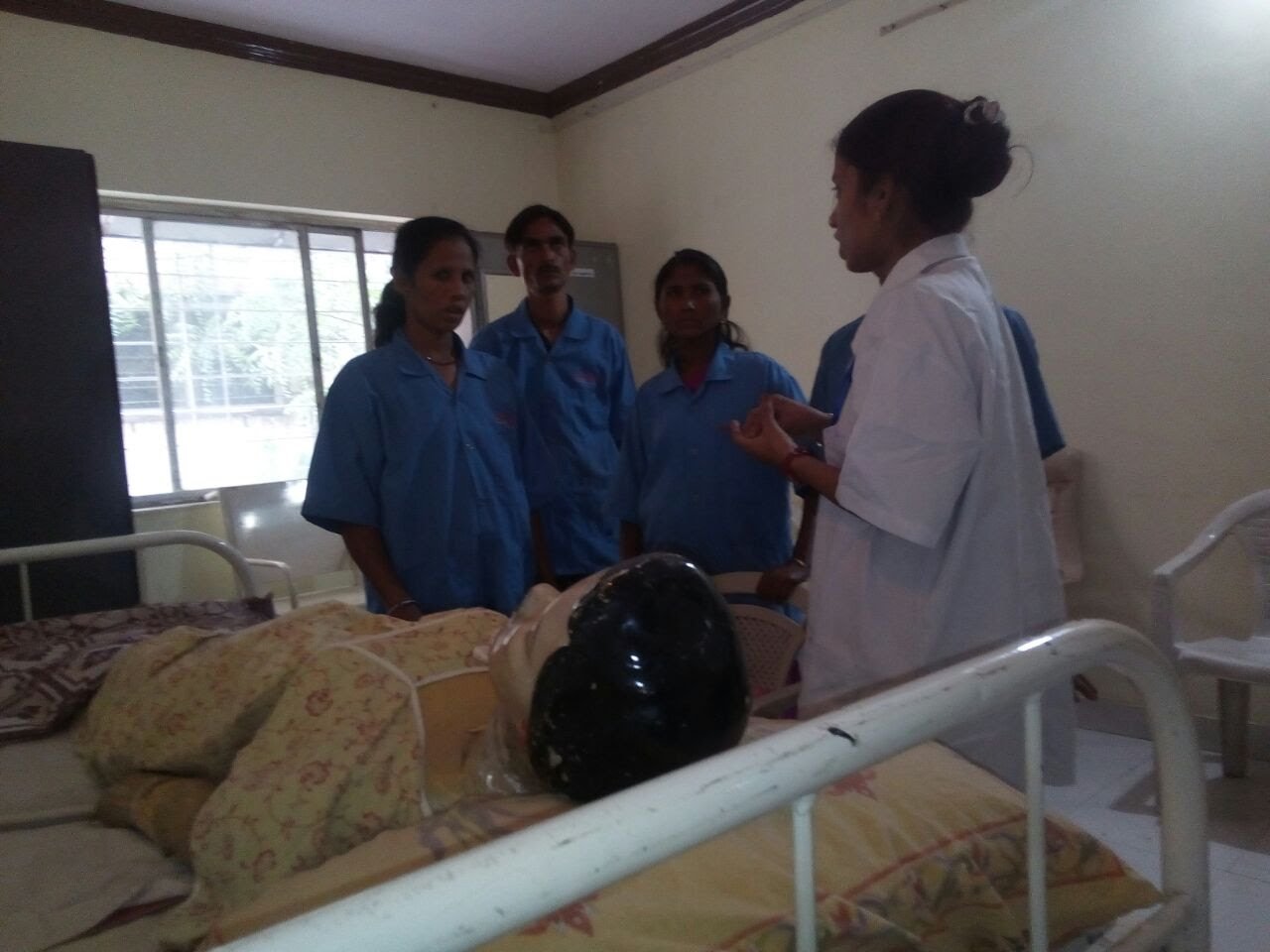 Trainer demonstrating care techniques to staff
